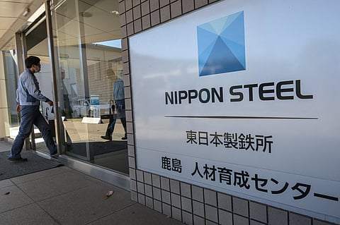 Politics pitfall An employee enters the human resources and educational building for Japanese company Nippon Steel during a media tour at their East Nippon Works Kashima Area facility in Kashima, Ibaraki prefecture, north of Tokyo. The Japanese industrial giant, on 11 December, slammed the ‘inappropriate’ role of politics after Bloomberg News reported that US President Joe Biden would block its planned takeover of US Steel.