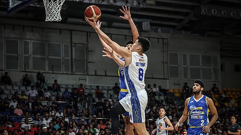 Calvin Oftana soars to a 42-point performance during TNT Tropang Giga’s 103-100 win over Magnolia in the PBA Commissioner’s Cup last night at the Ninoy Aquino Stadium.