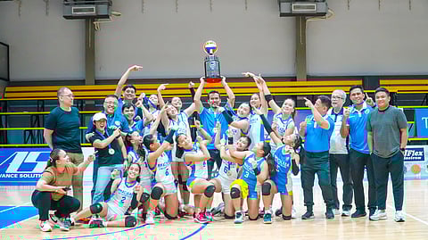 The victorious ICC Lady Blue Hawks celebrate with UCAL and ICC officials, led by Horacio Lim, Bernard Yang and Carmelo Navarro, after winning the women’s volleyball crown.
