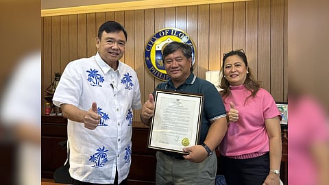 MORE Power chief Roel Zabala Castro receives a framed executive order by Iloilo Mayor Jerry P. Treñas namin him an "Adopted Son of Iloilo"