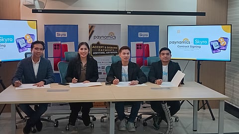 Skyro head for point-of-sale system Lowen Medina (third from left) and Paynamics co-founder and chief executive officer Mylene Chua-Magleo (second from left) recently signed a partnership between their respective companies for more accessible loan products at Pacific Star Building in Makati City.