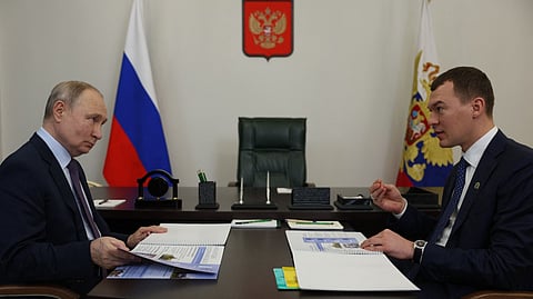 In this pool photograph distributed by Russian state agency Sputnik, Russia's President Vladimir Putin meets with the Governov of Khabarovsk region Mikhail Degtyaryov in the fareastern city of Khabarovsk on 11 January 2024.