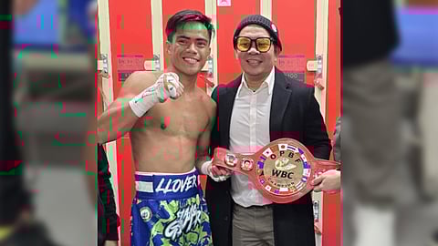 Unbeaten bantamweight Kenneth Llover beams with pride in the company of his chief handler Gerry Peñalosa.