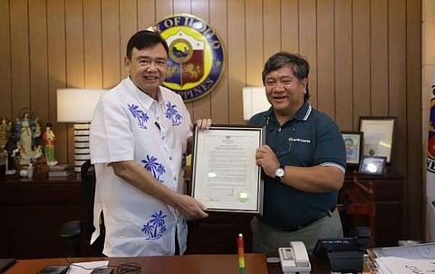 (FILE PHOTO) In recognition of his visionary leadership and unwavering commitment to the community, Roel Zabala Castro, president and CEO of More Power, has been honored as an adopted son of Iloilo City. Iloilo City Mayor Jerry P. Treñas (left) turns over a plaque containing Executive Order 162 declaring Castro as an adopted son of Iloilo City.