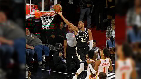 Giannis Antetokounmpo goes wild with 32 points and 14 rebounds to lead the Milwaukee Bucks to a 110-102 win over the Atlanta Hawks in their NBA regular season game on Saturday.