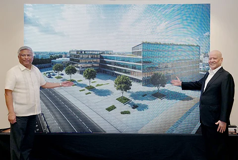 PAGCOR chairperson and CEO Alejandro H. Tengco (left) and SMC chairman Ramon S. Ang present the artist’s perspective of the new PAGCOR corporate office that will be built on a two-hectare lot at the Nayong Pilipino Complex in Pasay City.