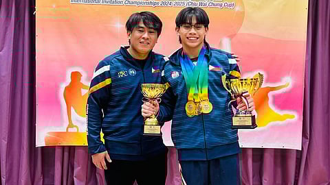 Karl Eldrew Yulo (right) shares the podium with his coach, Reyland Capellan, after bagging eight gold medals in the Chiu Wai Chung Cup in Hong Kong.