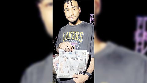 FRANCIS Lopez displays a copy of DAILY TRIBUNE that emphasizes the trust and confidence given to him by the UP Fighting Maroons during their UAAP Season 87 finals showdown with the La Salle Green Archers.