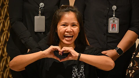 Filipina inmate on Indonesia death row, Mary Jane Veloso gestures during a press conference at the Soekarno-Hatta International Airport in Tangerang on 17 December 2024, before her repatriation to Philippines. A Filipina inmate sentenced to death in Indonesia was moved to capital Jakarta before she is expected to fly home on 18 December after the government signed an agreement to repatriate her.