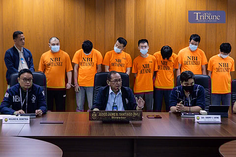 National Bureau of Investigation (NBI) Director Jaime Santiago presents seven Chinese nationals arrested during a Cybercrime Division (CCD) operation at a press conference on Tuesday.
The operation also rescued a trafficked victim, a house helper identified as “Let-let” (not her real name), who had been working for three months at the site where the scammers operated. Detained for two months, she was barred from using her phone or leaving the premises after discovering the illegal activities. She also reported delayed and insufficient salary payments.
Director Santiago said the investigation uncovered desktops containing fraudulent scripts, messaging applications with fictitious accounts, bank account details, and cryptocurrency investment schemes.
The seven Chinese nationals face charges under the Expanded Anti-Trafficking in Persons Act of 2022, computer-related forgery under the Cybercrime Prevention Act of 2012, social engineering schemes under the Anti-Financial Account Scamming Act, and the Domestic Workers Act.
The NBI said it is still identifying other individuals involved and investigating possible links to rogue Philippine Offshore Gaming Operators (POGOs) operating on a smaller scale.