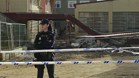 A police officer stands in front of Luis Vives college of Massanassa, south of Valencia, on November 24, 2024