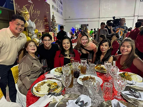Carlos Yulo and girlfriend, Chloe San Jose, mingle with the members of the Gymnastics Association of the Philippines board of directors during their Christmas party on Wednesday.