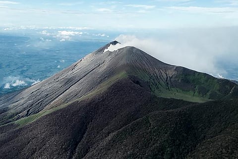 (FILE PHOTO) THIS handout photo taken and released by the Philippine Air Force on 12 December shows a view of the crater on Kanlaon volcano in Negros Occidental taken during an aerial inspection following an eruption that occurred on 9 December.