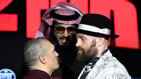 Tyson Fury (right) and Oleksandr Usyk face off during a press conference ahead of their undisputed heavyweight world championship rematch in Riyadh, Saudi Arabia.
