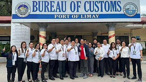 Port of Limay, Bataan personnel led by district collector Atty. Kriden F. Balgomera, 8th left, pose for a photo in of their office after news broke out that they were issued the prestigious ISO.