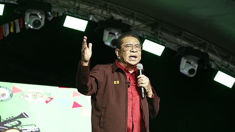 Senatorial candidate Luis 'Manong Chavit' Singson addresses the crowd in Calasiao town, Pangasinan province recently as he explains his visions and platforms that will ensure a better life to all Filipinos.