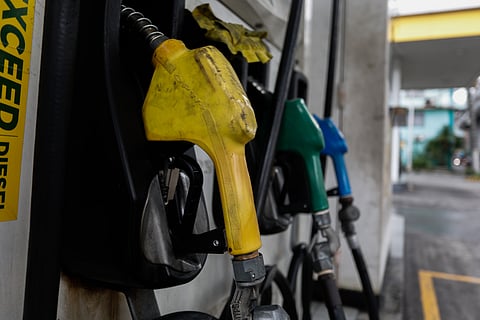 A gasoline attendant, his movements swift and focused, fills the tank of a truck in Quezon City on Tuesday. The steady rise in fuel prices casts a heavy shadow over the routine task, as the cost climbs with each click of the nozzle, adding to the mounting financial strain felt across the city.