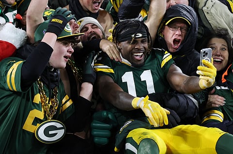 Jayden Reed #11 of the Green Bay Packers celebrates with fans after his team defeated the against the New Orleans Saints at Lambeau Field on December 23, 2024 in Green Bay, Wisconsin. Stacy Revere/Getty Images/AFP
Stacy Revere / GETTY IMAGES NORTH AMERICA / Getty Images via AFP