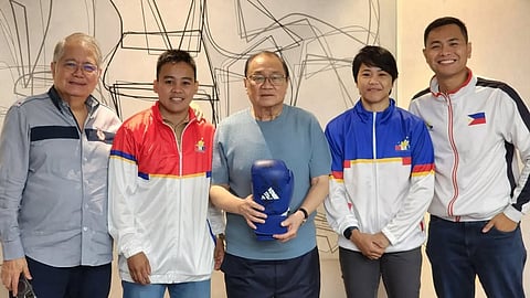 Nesthy Petecio (second from left) and Aira Villegas (second from right) offer their Paris Olympic victories to boxing chairman emeritus Manny Pangilinan (middle). Also shown are boxing chairman Ricky Vargas and secretary general Marcus Manalo.