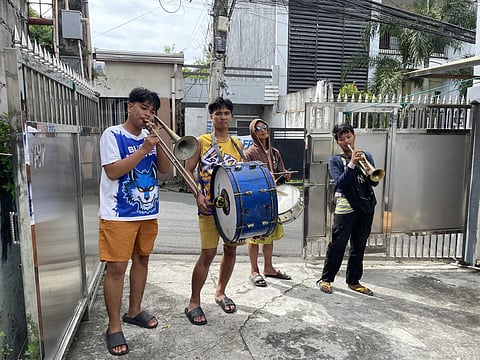 The Victory Band serenades a household with Christmas tunes in Binangonan, Rizal, keeping the caroling spirit alive in the country.