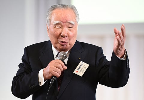 Osamu Suzuki, chairperson of Japan’s auto maker Suzuki, speaks at a press conference in Tokyo. He led the development of the car brand into a global industrial symbol.