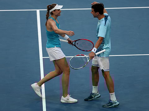 Kazakhstan's Elena Rybakina (L) and teammate Alexander Shevchenko celebrate their win at the United Cup
