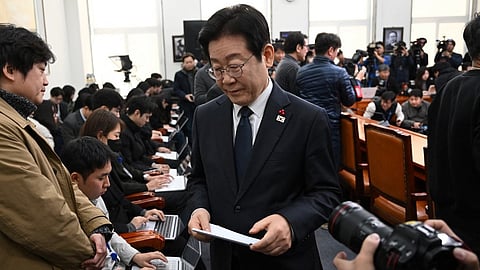 South Korea's main opposition Democratic Party leader Lee Jae-myung leaves after delivering a public statement on the impeachment motion against acting president Han Duck-soo at the National Assembly in Seoul on December 27, 2024.