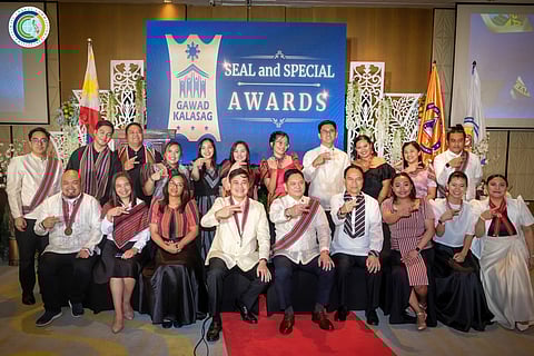 Secretary Robert E.A. Borje, vice chairperson and executive director of CCC (4th from left, seated), with some of the 24th Gawad KALASAG awardees during the national ceremony in Baguio City.