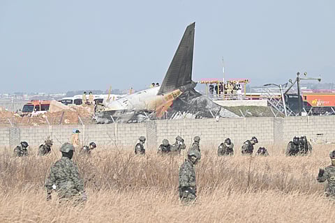 Ghastly task South Korean soldiers search for missing passengers near the wreckage of the Jeju Air Boeing 737-800 plane that was consumed by fire upon landing at the Muan International Airport in South Jeolla Province, some 288 kilometers southwest of Seoul.