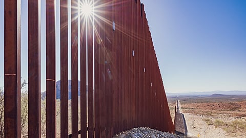 Part of the border wall built under Donald Trump's administration is seen at the US-Medican border east of Douglas, Arizona, on 15 October 2024.