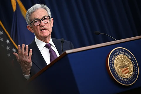 US Federal Reserve chairman Jerome Powell gestures as he speaks at a briefing after the Monetary Policy Committee meeting in Washington, DC, on 18 December 2024. The US Federal Reserve signaled a slower pace of cuts ahead, amid uncertainty about inflation and US President-elect Donald Trump’s economic plans. Policymakers voted 11-to-1 to lower the central bank’s key lending rate to between 4.25 percent and 4.50 percent, the Fed announced in a statement. They also penciled in just two quarter-point rate cuts for next year, and sharply hiked their inflation outlook for 2025.