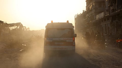 Ambulances transport wounded Palestinians from Kamal Adwan Hospital to Al-Shifa Hospital in Gaza City