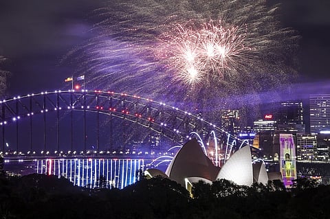 Fireworks light up the Sydney Harbor Bridge and Sydney Opera House during the early New Year’s Eve celebrations in Sydney on 31 December, 2024.