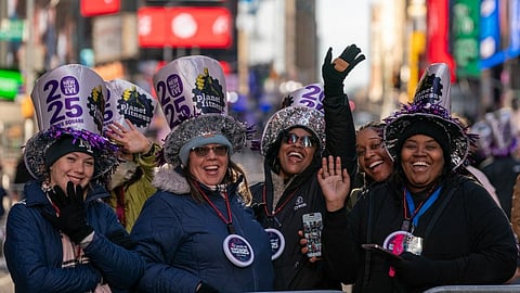 A small crowd of revelers celebrate in Times Square prior to the New Year's Eve celebrations on December 31, 2024 in New York City.