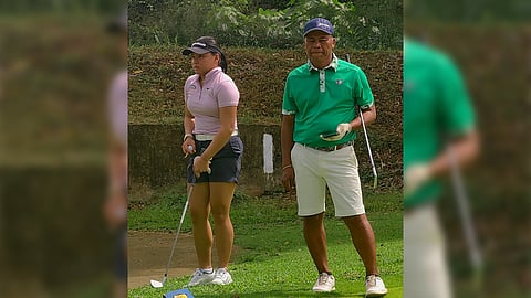 Rianne Malixi is shown with former Philippine Open champion Elmer Salvador during a practice round at the Apo Golf and Country Club in Davao City.