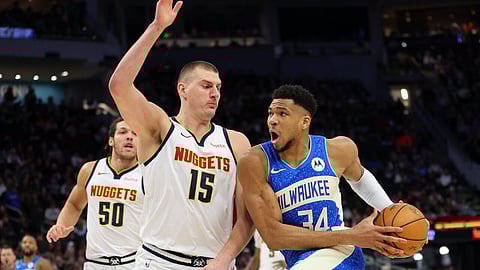 Milwaukee's Giannis Antetokounmpo, right, and Denver's Nikola Jokic, left, were the top vote-getters in the first ballot report on fan voting for next month's NBA All-Star Game