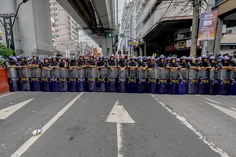 All walls lead to Mendiola: Police forces secures a barricade in Recto Avenue to control the movement of progressive groups heading to Mendiola in the City of Manila, 10 December 2024.