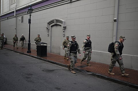 Members of the National Guard walk through the French Quarter in New Orleans after the truck attack.