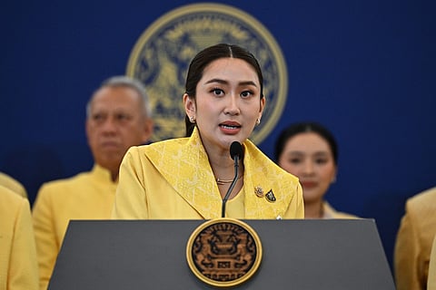 Thailand's new Prime Minister Paetongtarn Shinawatra (C), known by her nickname "Ung Ing" and daughter of former prime minister Thaksin Shinawatra, addresses the media after a special cabinet meeting at Government House in Bangkok on September 7, 2024. - Paetongtarn Shinawatra, the heiress of Thailand's most famous political dynasty, was sworn in as prime minister on September 6, capping a month of turmoil in which her predecessor was thrown out of office and the main opposition party dissolved.