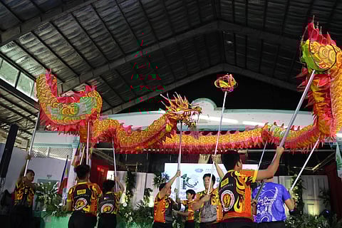 Dragon dancers of the Pagoda Philippine Athletic Association perform at the opening of the Tzu Chi Bohol 10th anniversary celebration at the Cogon gym in Tagbilaran City, Bohol on 15 December 2024.