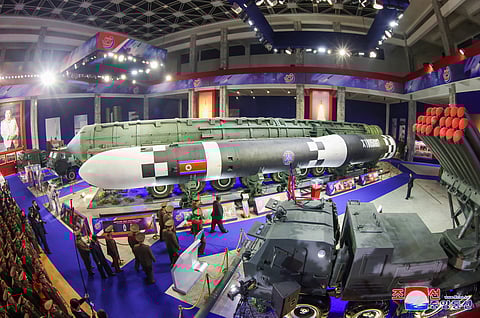 This picture taken on 21 November, 2024 and released from North Korea's official Korean Central News Agency (KCNA) on 22 November, 2024 shows North Korean leader Kim Jong Un walking past an intercontinental ballistic missile (ICBM) and other weaponry on display during the National Defence Development-2024 exhibition in Pyongyang.
STR / KCNA VIA KNS / AFP