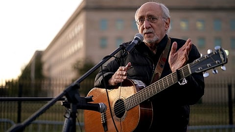 Peter Yarrow, founding member of the legendary folk group Peter, Paul and Mary, sings and speaks about the 1967 March on the Pentagon during a vigil marking the 50th anniversary of the protest outside the Pentagon October 20, 2017 in Arlington, Virginia.