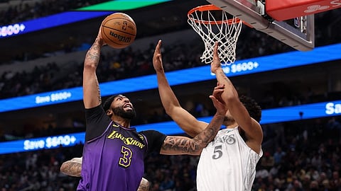 Anthony Davis #3 of the Los Angeles Lakers is defended by Quentin Grimes #5 of the Dallas Mavericks during the first quarter at American Airlines Center on January 07, 2025 in Dallas, Texas.