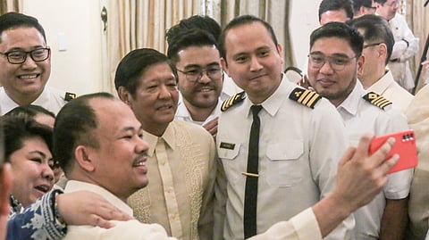 President Ferdinand R. Marcos Jr. joins a spirited ‘groufie’ after witnessing the historic signing of the Implementing Rules and Regulations with seaman of the Magna Carta of Filipino Seafarers Act. The signing ceremony, held at the Kalayaan Hall in Malacañang Palace on Wednesday, marked a defining moment for Filipino seafarers as Migrant Workers Secretary Hans Leo J. Cacdac and Maritime Industry Authority Administrator Sonia B. Malaluan sealed the deal with their signatures.