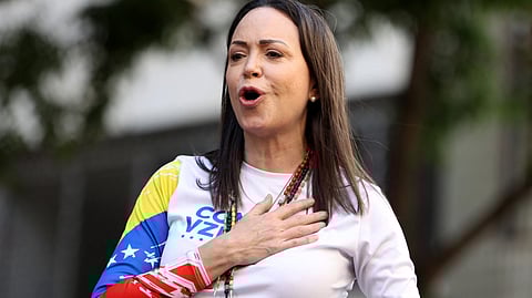 Venezuelan opposition leader Maria Corina Machado gestures to supporters during a protest called by the opposition on the eve of the presidential inauguration, in Caracas on 9 January 2025. Machado, who emerged from hiding to lead protests against the swearing-in of Nicolas Maduro for a highly controversial third term as president, was arrested after being "violently intercepted upon exiting the rally," according to her security team.