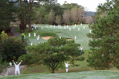 Caddies at Camp John Hay Golf Club wait for the ceremonial tee marking a new beginning under the Bases Conversion and Development Authority through the consortium of Golfplus Management and DuckWorld PH.
