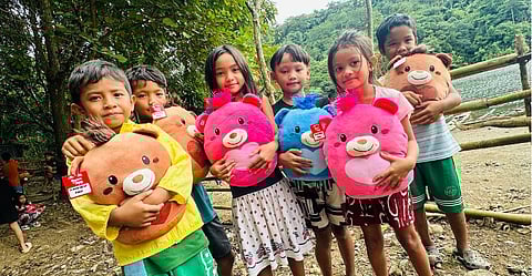 SM City Baliwag visits the Dumagat Tribe, bringing festive joy to children in need with every bear gifted.