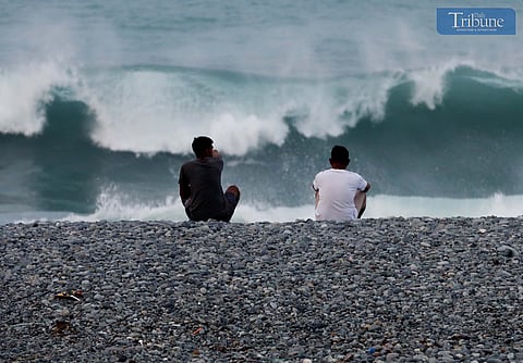 (FILES) Locals take a moment to enjoy watching the waves and collecting pebbles on the picturesque Lunas Pebbles Beach in La Union.