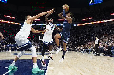Ja Morant #12 of the Memphis Grizzlies shoots the ball during the game against the Minnesota Timberwolves on January 11, 2025 at Target Center in Minneapolis, Minnesota. NOTE TO USER: User expressly acknowledges and agrees that, by downloading and or using this Photograph, user is consenting to the terms and conditions of the Getty Images License Agreement. Mandatory Copyright Notice: Copyright 2025 NBAE Jordan Johnson/NBAE via Getty Images/AFP
Jordan Johnson / NBAE / Getty Images / Getty Images via AFP