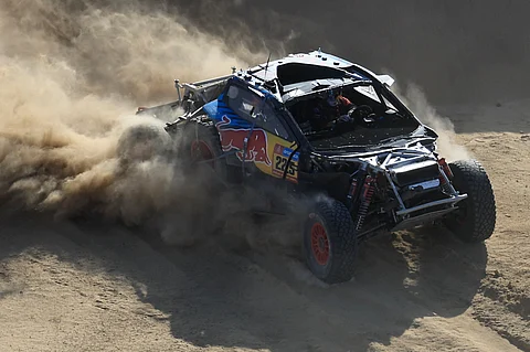 Spanish driver Carlos Sainz steers his car assisted by co-driver Lucas Cruz during stage 2B of the 47th Dakar Rally.